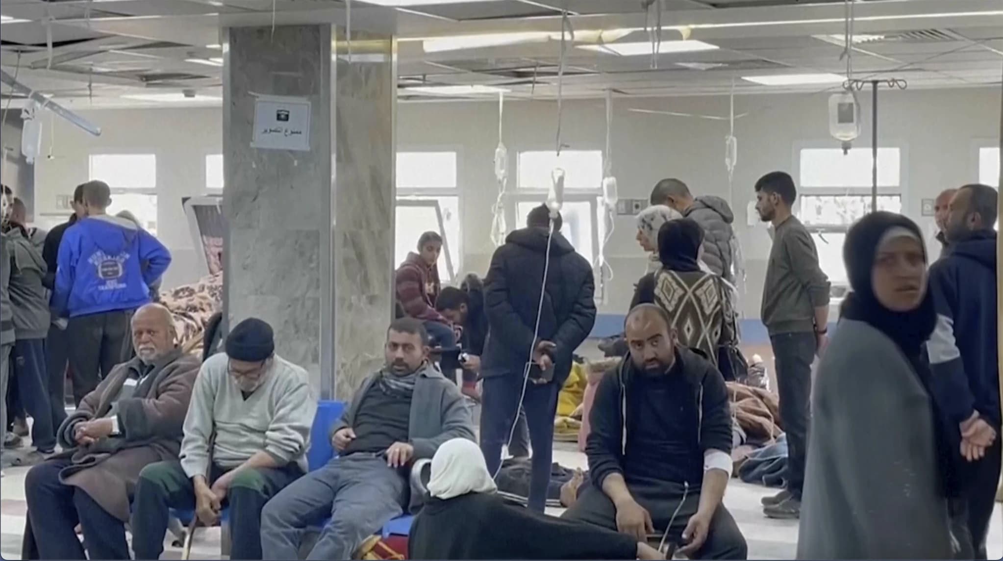 Palestinians wait in a hospital in Gaza