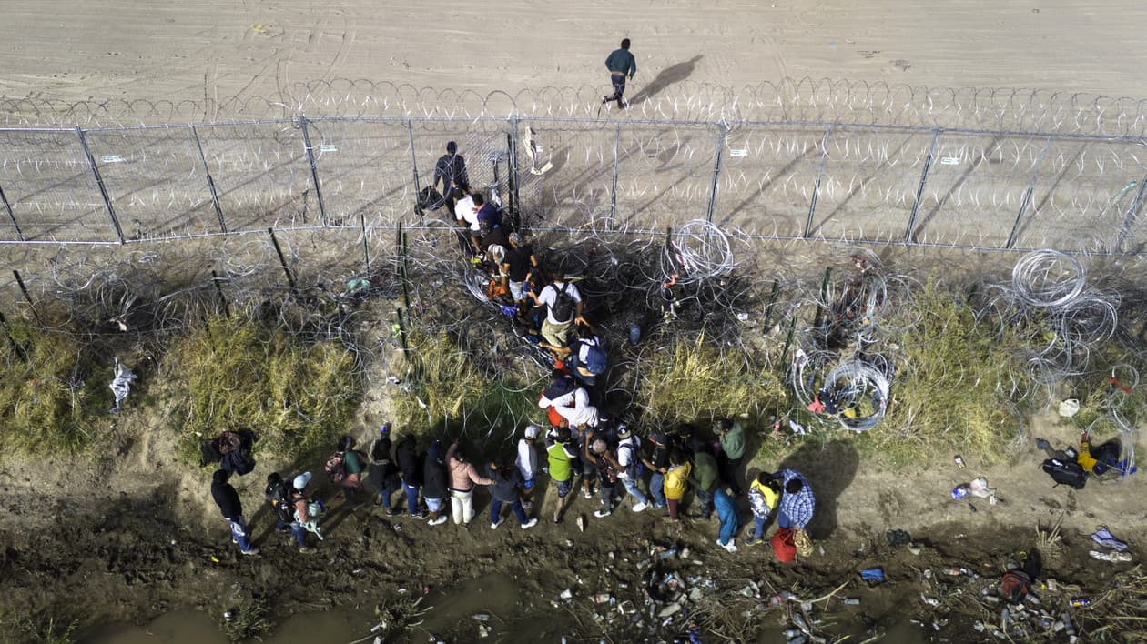 Migrants crossing the southern Texas border