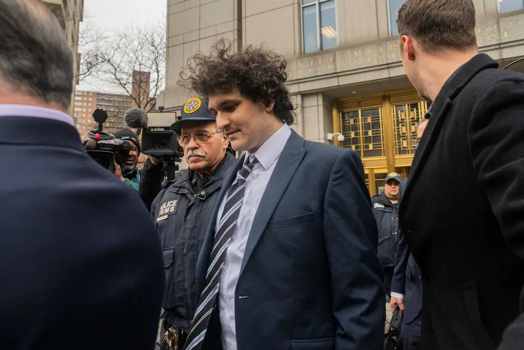 Sam Bankman-Fried leaves a courthouse