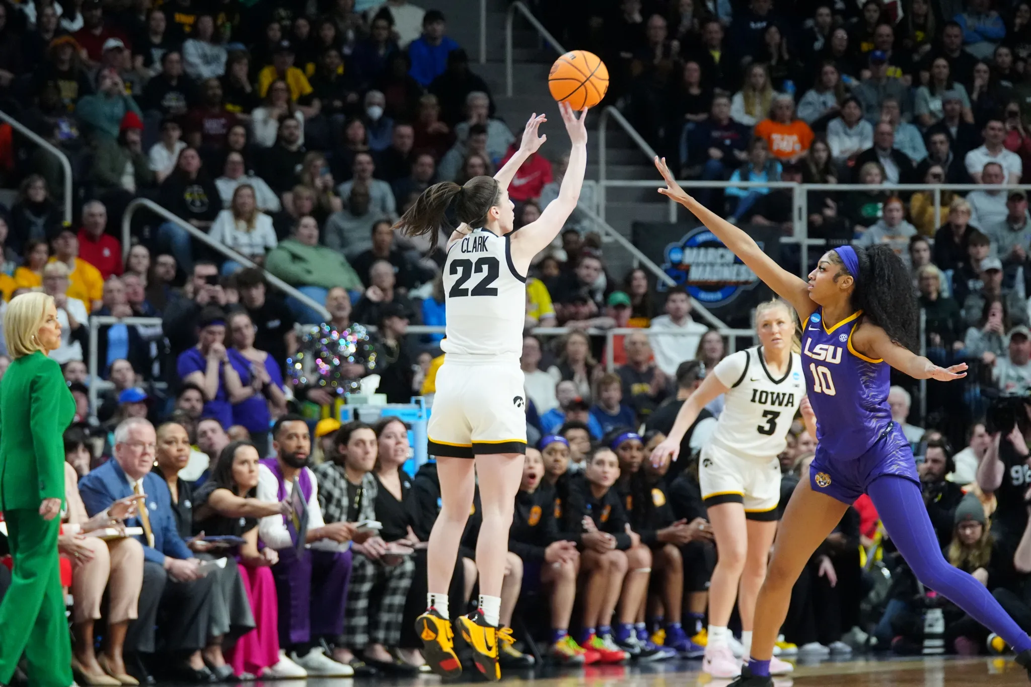 Caitlin Clark shoots over Angel Reese