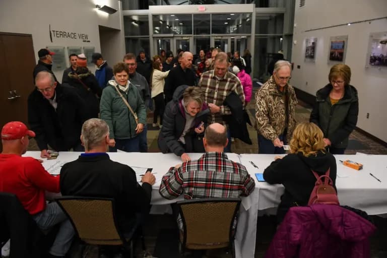 Iowa caucus participants signing in