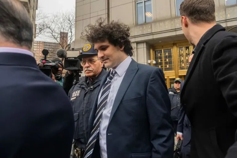 Sam Bankman-Fried leaves a courthouse