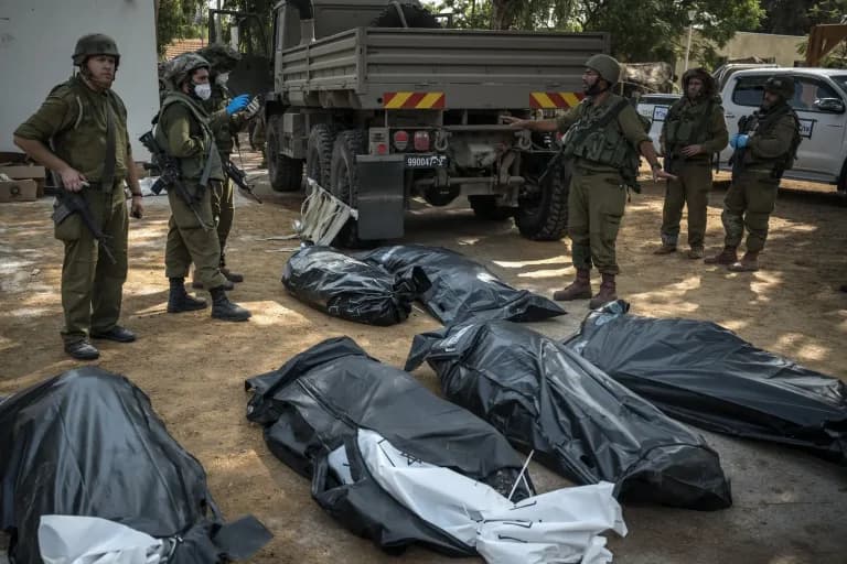 Israeli soldiers with victims of October 7th