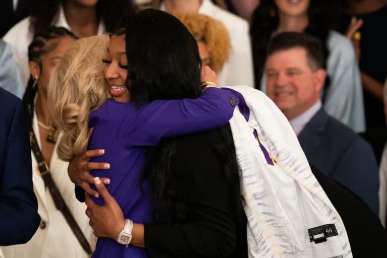 Biden and Reese embrace at the ceremony. 