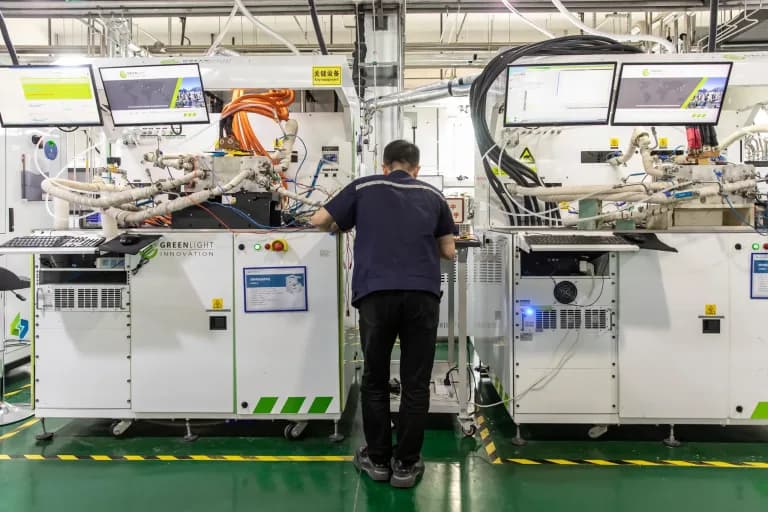 A worker in Shanghai testing fuel cell units
